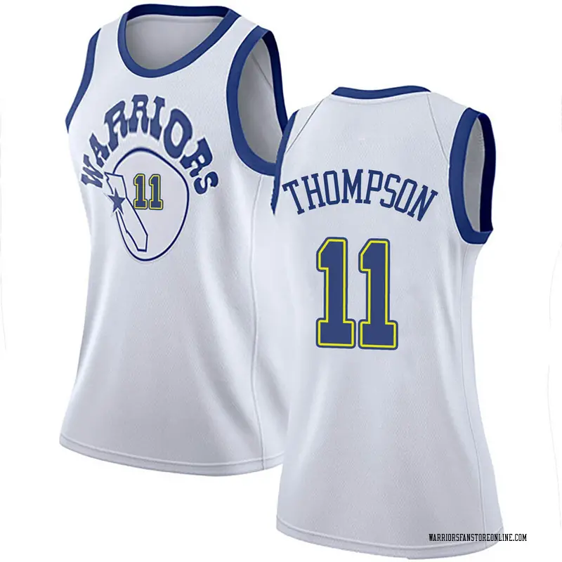 white and gold nike shirt